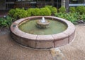 Wishing well with small fountain at the Forth Worth Botanic Garden.