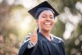 Wishing you the best of luck for the future. Closeup shot of a young woman showing thumbs up on graduation day. Royalty Free Stock Photo