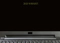 2021 wishlist. Laptop screen displaying 2021 wishlist in golden colored text. Royalty Free Stock Photo