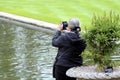 Wisley, Surrey, UK - April 30 2017: Rear view of a woman taking Royalty Free Stock Photo