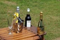 Wisley, Surrey, UK - April 30 2017: Stylish wooden drinks table, with a bottle of Pimms Strawberry Limited Edition, and two champ