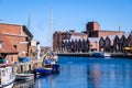 Wismar, Germany - May 8, 2023: Scenic summer outdoor view of the Old Port pier town architecture with ships and boats in