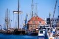 Wismar, Germany - May 8, 2023: Scenic summer outdoor view of the Old Port pier town architecture with ships and boats in
