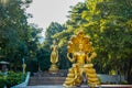 Wisnu or Narayana and Golden Buddha statue in Huay Tueng Thao reservoir park.