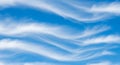 Wispy Clouds Drape a Vibrant Blue Sky Royalty Free Stock Photo