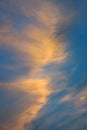Wispy pink and orange clouds captured by the warm sunset Royalty Free Stock Photo