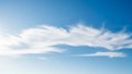 Wispy White Cirrus Clouds Drifting Across a Clear Bright Blue Sky 105454 Royalty Free Stock Photo