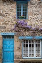 Wisteria on a cottage wall in rural France Royalty Free Stock Photo