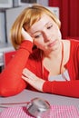 Wistful housewife in red Royalty Free Stock Photo