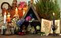 Witch altar table with magic book, flowers and spiritual objects Royalty Free Stock Photo