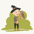 A witch boy in a black hat holding a bouquet of magic flowers and herbs and a large lazy owl in her hands