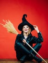 Witch broom or broomstick. appy Halloween. Happy gothic young woman in witch halloween costume. Halloween concept.