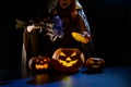 A witch casts a spell in the dark on halloween eve Royalty Free Stock Photo
