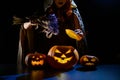 A witch casts a spell in the dark on halloween eve Royalty Free Stock Photo