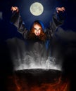 Witch with cauldron on night sky background Royalty Free Stock Photo