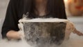 Witch Conjuring, Putting Magic Spell And Cooking Potion In Pot With White Smoke