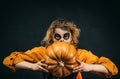 Witch eyes for Halloween banner. Beautiful young surprised woman in witch hat costume and holding Witch broom. Happy Royalty Free Stock Photo