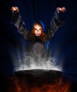 Witch girl with cauldron Royalty Free Stock Photo