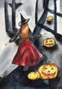 The witch in the hat walks through the forest past the pumpkins