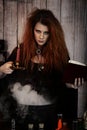 Witch holding spell book and candle