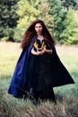 Witch holding a spurts of flame Royalty Free Stock Photo
