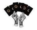 The witch lays out tarot cards. Two female hands and a mystical deck of cards with the moon and sun. Magic hand drawing Royalty Free Stock Photo