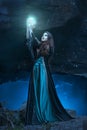 The witch with magic ball in her hands causes a spirits Royalty Free Stock Photo