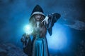 The witch with magic ball in her hands causes a spirits Royalty Free Stock Photo