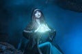 The witch with magic ball in her hands causes a spirits Royalty Free Stock Photo