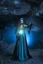 The witch with magic ball in her hands causes a spirits Royalty Free Stock Photo