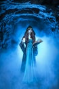 The witch with magic ball in her hands causes a spirits Royalty Free Stock Photo