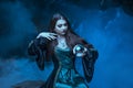 The witch with magic ball in her hands causes a spirits Royalty Free Stock Photo