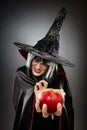 Witch offering a poisoned apple