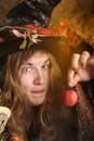Witch with poisened apple Royalty Free Stock Photo