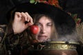 Witch with poisened apple Royalty Free Stock Photo