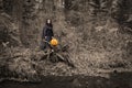 Witch with pumpkin in the forest Royalty Free Stock Photo