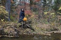 Witch with pumpkin in the forest 2 Royalty Free Stock Photo