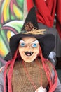 Witch puppet with a malicious smile