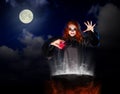 Witch with red potion on night sky background Royalty Free Stock Photo