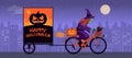 Witch riding a bicycle and Happy Halloween wishes Royalty Free Stock Photo