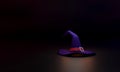 The witch`s hat on a black background represents the spooky, magical, and mysterious Halloween season