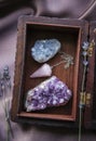 Witch tools inside beautiful old wood box. Rose quartz pendulum natural amethyst and celestite crystal clusters. Dry lavender flo