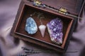 Witch tools inside beautiful old wood box. Rose quartz pendulum natural amethyst and celestite crystal clusters. Dry lavender flo