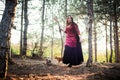 Witch in the wood. Practicing magic. Royalty Free Stock Photo