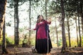 Witch in the wood. Practicing magic. Royalty Free Stock Photo