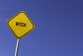 Witch - yellow sign with blue sky background