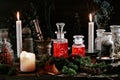 Witchcraft still life concept with potion, herbs ingredients candles and magical equipment Royalty Free Stock Photo