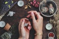 Witches hands on a table ready for spell work