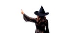 Witching Hour at Halloween, witch pointing at white copy space. Generative AI