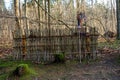 A witchs broom by a branch fence in a fairy-tale, magical forest